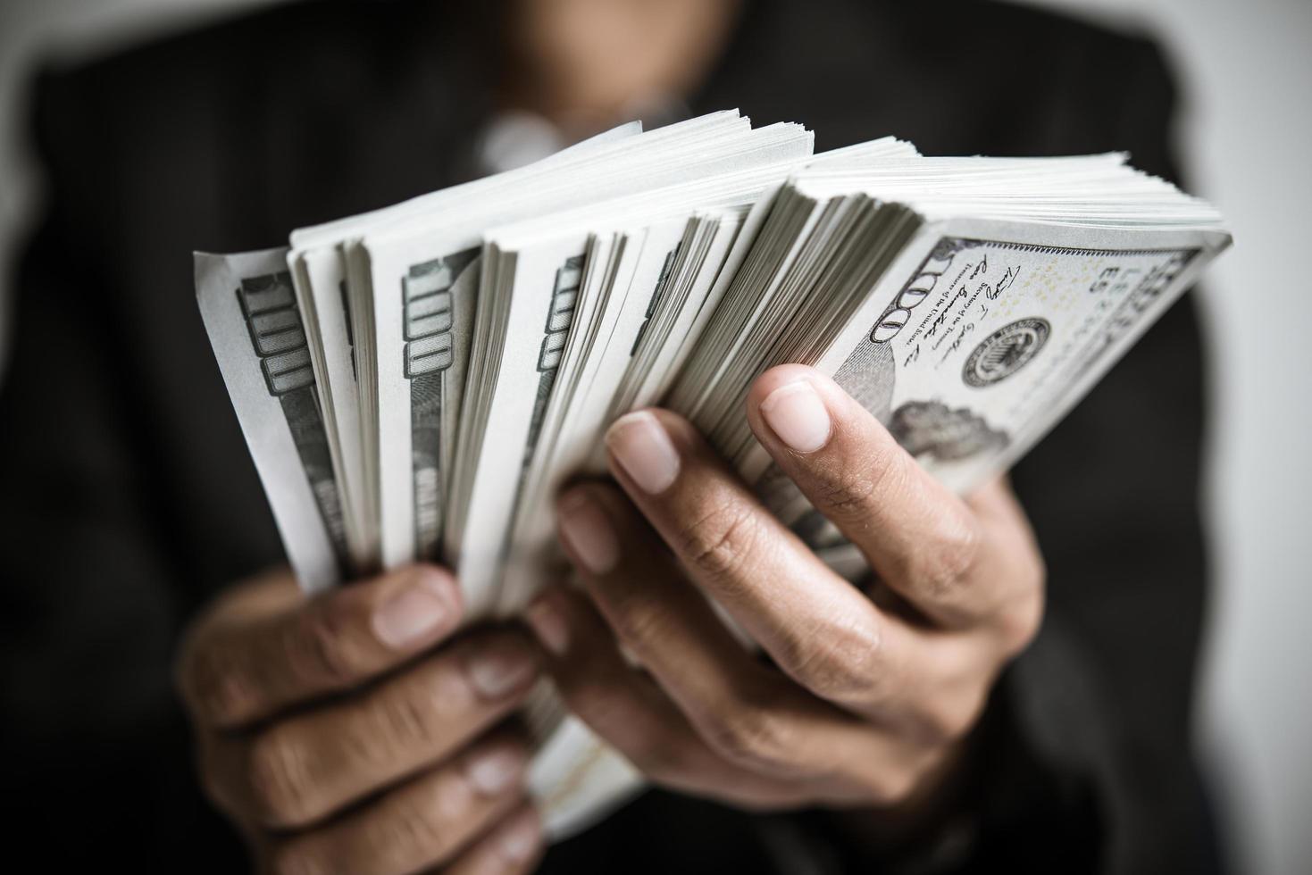 hands-of-woman-holding-money